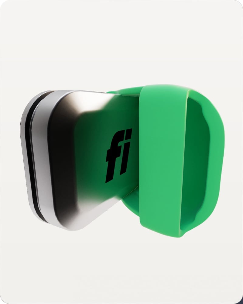 A green Fi Mini tracker clipped onto a collar